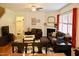 Cozy living space with a fireplace, comfortable seating, and natural light from large windows at 642 Collington Dr, Mebane, NC 27302