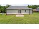 The backyard features a patio and a lush lawn, perfect for outdoor enjoyment at 65 Alcock Ln, Youngsville, NC 27596