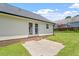 This backyard features a concrete patio area and ample room for outdoor activities at 65 Alcock Ln, Youngsville, NC 27596