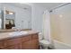 Cozy bathroom featuring a shower with tub and a vanity with storage at 65 Alcock Ln, Youngsville, NC 27596
