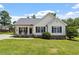 Charming single-Gathering home with a manicured lawn, covered porch, and traditional design elements at 65 Alcock Ln, Youngsville, NC 27596