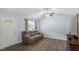 Inviting living room featuring a neutral color palette, hardwood floors, and a comfortable reclining sofa at 65 Alcock Ln, Youngsville, NC 27596
