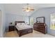Spacious main bedroom with vaulted ceilings, a ceiling fan and natural light at 65 Alcock Ln, Youngsville, NC 27596