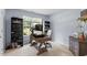 Well-lit office space with a desk, shelves and natural light from the window at 65 Alcock Ln, Youngsville, NC 27596