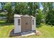 The backyard features a shed with ample room for storage or hobbies at 65 Alcock Ln, Youngsville, NC 27596