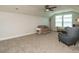 Large bonus room with neutral paint and carpet, large windows and ample seating at 67 Blue Spruce Cir, Clayton, NC 27527