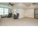 Spacious bonus room with vaulted ceilings, plush carpet, and cozy seating area, perfect for relaxation at 67 Blue Spruce Cir, Clayton, NC 27527