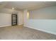 Bonus room featuring neutral paint, carpet, and built in shelving at 67 Blue Spruce Cir, Clayton, NC 27527