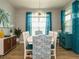 Bright dining room features stylish light fixture, table with white chairs and blue accents, with natural light at 67 Blue Spruce Cir, Clayton, NC 27527