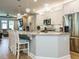 Open kitchen with a large island, granite countertops, stainless steel appliances, and pendant lighting at 67 Blue Spruce Cir, Clayton, NC 27527