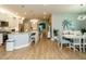Open concept living area with adjacent kitchen, dining area with bright natural light at 67 Blue Spruce Cir, Clayton, NC 27527