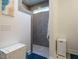 Tiled walk-in shower featuring grey tiling, and a glass partition at 67 Blue Spruce Cir, Clayton, NC 27527