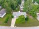 Drone shot of property with mature trees, and a wooden backyard deck at 700 Mossburn Ct, Fuquay Varina, NC 27526