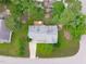 An aerial view of a single-Gathering home with a deck and beautifully manicured lawn at 700 Mossburn Ct, Fuquay Varina, NC 27526