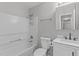 Bathroom features a shower and bath combination with a neutral-toned sink at 700 Mossburn Ct, Fuquay Varina, NC 27526