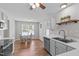 Cozy kitchen with table, stainless dishwasher and sink, and bright lighting at 700 Mossburn Ct, Fuquay Varina, NC 27526