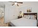 Comfortable bedroom with carpet floors, ceiling fan, and ensuite bathroom at 7002 Longstreet Dr # C, Raleigh, NC 27615