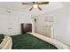 Bedroom featuring a ceiling fan, carpet flooring, and two dressers for ample storage space at 7002 Longstreet Dr # C, Raleigh, NC 27615