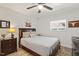Cozy bedroom featuring a ceiling fan and ample natural light from the window at 7002 Longstreet Dr # C, Raleigh, NC 27615