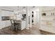 Open kitchen with granite countertops, white cabinets, and stainless-steel appliances at 7002 Longstreet Dr # C, Raleigh, NC 27615