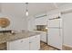 Bright kitchen with granite countertops, white cabinets, and stainless-steel appliances at 7002 Longstreet Dr # C, Raleigh, NC 27615