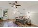 Inviting living room featuring stylish sofa, elegant lighting, and a vibrant area rug at 7002 Longstreet Dr # C, Raleigh, NC 27615