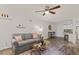 Charming living room showcasing stylish decor, comfortable seating, and seamless kitchen view at 7002 Longstreet Dr # C, Raleigh, NC 27615