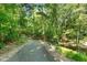 Picturesque walking trail surrounded by lush greenery and trees at 7002 Longstreet Dr # C, Raleigh, NC 27615