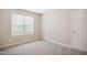 Bright, airy bedroom with a large window and neutral walls, creating a blank canvas for personalized decor at 733 Bluffcreek Dr, Fuquay Varina, NC 27526