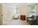 Comfortable bedroom with neutral carpeting, chair rail, and natural light from two windows at 733 Bluffcreek Dr, Fuquay Varina, NC 27526