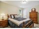Cozy bedroom with a comfortable bed, matching nightstands, and a dresser, providing a relaxing retreat at 733 Bluffcreek Dr, Fuquay Varina, NC 27526