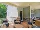 Relaxing covered deck with comfortable seating and a cozy atmosphere at 733 Bluffcreek Dr, Fuquay Varina, NC 27526