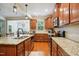 Charming kitchen with granite countertops, stainless steel appliances, and a view into the breakfast nook at 733 Bluffcreek Dr, Fuquay Varina, NC 27526