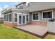 Enclosed sunroom off the back, plus wooden deck with built-in outdoor grill at 7414 Brandon Allen Ave, Raleigh, NC 27613