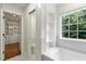 Bright bathroom with built in shelves and a tub for relaxing at 7414 Brandon Allen Ave, Raleigh, NC 27613
