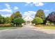 Charming clubhouse framed by trees and manicured landscaping, offering a welcoming community gathering space at 7414 Brandon Allen Ave, Raleigh, NC 27613