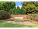 Well-maintained Longlake entrance with brick signage surrounded by lush landscaping and mature trees at 7414 Brandon Allen Ave, Raleigh, NC 27613