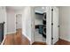 Modern laundry room with stacked washer/dryer and built-in cabinets at 7414 Brandon Allen Ave, Raleigh, NC 27613