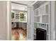 Convenient pantry with built-in shelves and a mini-fridge, offering ample storage space next to the kitchen area at 7414 Brandon Allen Ave, Raleigh, NC 27613