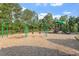 Community playground with swings, slides, and climbing structures offering a fun and active space for children at 7414 Brandon Allen Ave, Raleigh, NC 27613