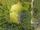 Aerial view of the house and surrounding landscape featuring extensive greenery and a long driveway at 7595 Clayton Blvd # B, Clayton, NC 27520