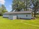 Back exterior featuring a storage shed and an air conditioning unit at 7595 Clayton Blvd # B, Clayton, NC 27520