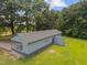 An aerial shot of the back of the home, featuring a screened porch and storage shed at 7595 Clayton Blvd # B, Clayton, NC 27520