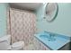 Bathroom featuring a blue sink, patterned shower curtain and white toilet at 7595 Clayton Blvd # B, Clayton, NC 27520