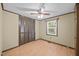 Cozy bedroom with ceiling fan, wood-look floors, and a closet at 7595 Clayton Blvd # B, Clayton, NC 27520