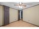 Bedroom featuring ceiling fan, wood-look floors, and a closet at 7595 Clayton Blvd # B, Clayton, NC 27520