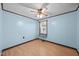 Comfortable bedroom with ceiling fan, wood-look floors, and natural light at 7595 Clayton Blvd # B, Clayton, NC 27520
