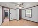 Bedroom showcasing neutral walls and trim and a ceiling fan with light fixture at 7595 Clayton Blvd # B, Clayton, NC 27520