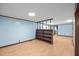 Bonus room featuring wood-look flooring, blue walls and a built-in bookshelf at 7595 Clayton Blvd # B, Clayton, NC 27520