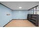 Bonus room with wood-look flooring, light and a built-in bookshelf at 7595 Clayton Blvd # B, Clayton, NC 27520